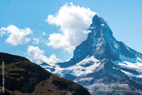 Fascinating landscape with  with the top of the mountain Matterhorn in the clouds in the Swiss Alps, near Zermatt, Switzerland