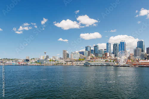 Bright and sunny panoramic view of Seattle skyline from the water