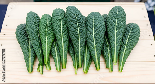 Fresh green kale leaves on wooden table