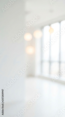Bright Airy Blurred White Interior Room with Natural Light and Window for Background Overlay Concept