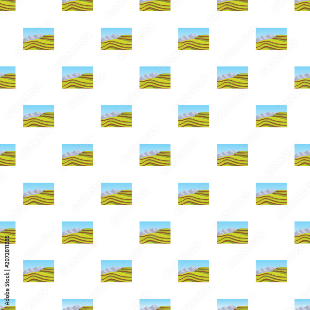 Obraz premium Repeating pattern showing rolling green fields, distant mountains, and blue sky