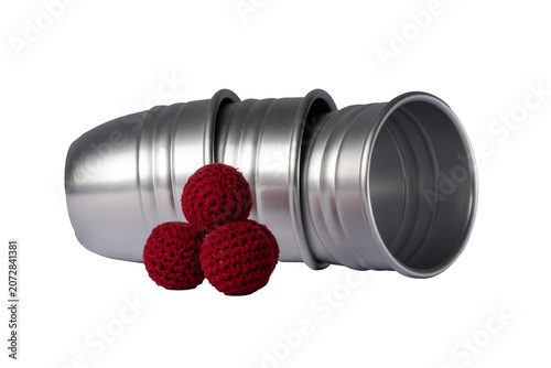 Fotografía Magic cups and red balls isolated on white