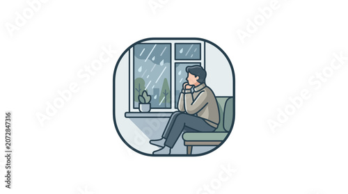 Tableau sur toile A person sits by a window watching the rain and reflecting quietly indoors