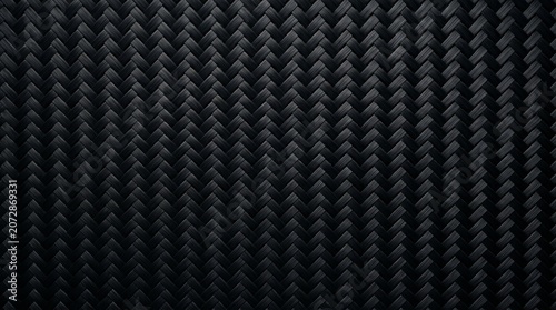 Detailed dark black carbon fiber weave pattern captured with high contrast lighting on transparent background