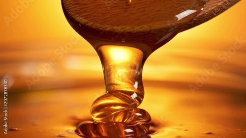 Golden Honey Pouring From Spoon, Closeup Macro Of Viscous Amber Syrup Cascading From Wooden Spoon Onto Reflective Surface, Warm Backlight, Glossy Texture, Sticky Drops Forming, Inviting Gourmet