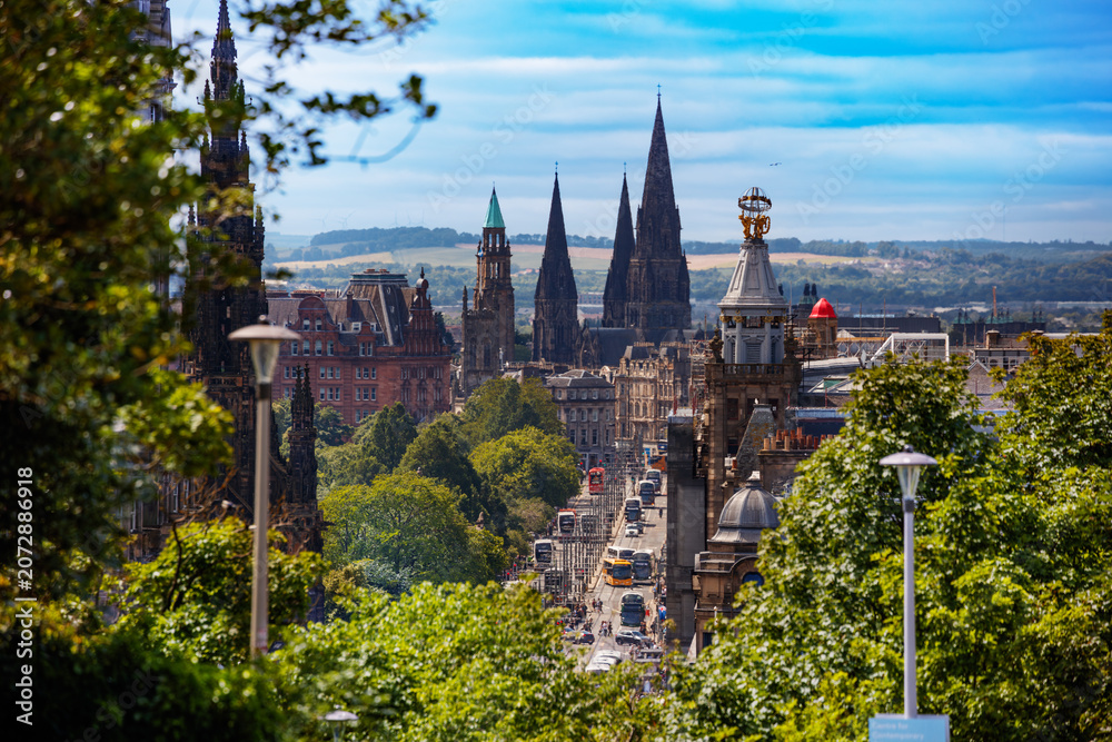 Fototapeta premium Princes street in Edinburgh with Gothic spires and trees, UK