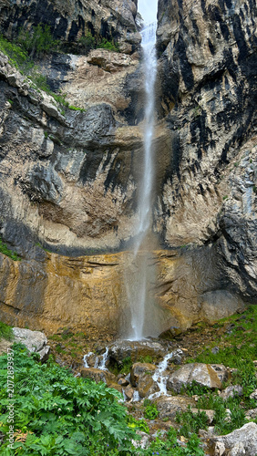 Mountain Waterfall Flowing Through Green Rocky Valley in Armenia