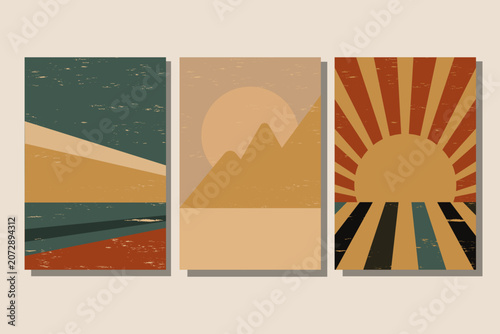 Three vertical vintage abstract art posters display stylized landscapes. One shows a geometric sea or desert scene. Another features mountains and a sun.