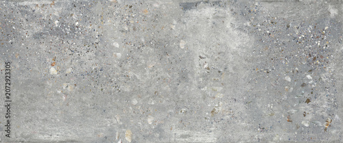 Gray terrazzo concrete texture background with natural stone fragments and industrial cement surface details. Modern architectural material featuring rough terrazzo patterns, neutral tones, and realis