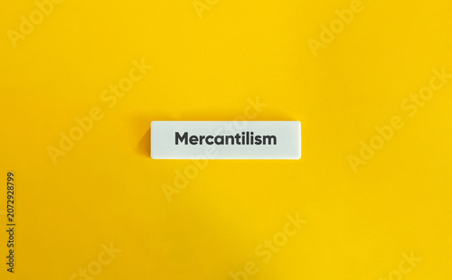 Mercantilism word tile on yellow background