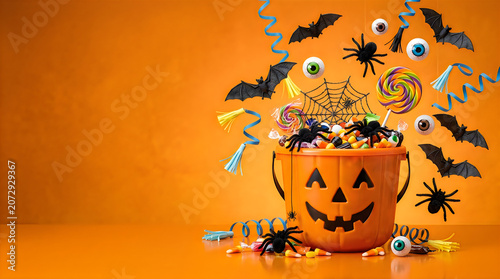Halloween Candy Bucket with Spiders, Bats, and Eyeballs on Isolated on a transparent background