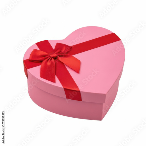 Pink heart shaped gift box with a bright red ribbon bow tied on top for romantic holidays and special celebration events