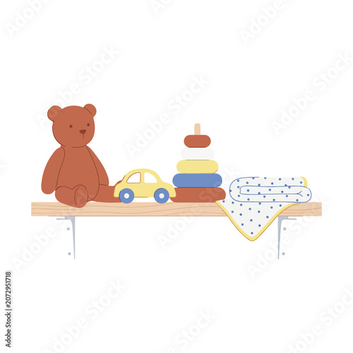 Brown teddy bear sitting on shelf.