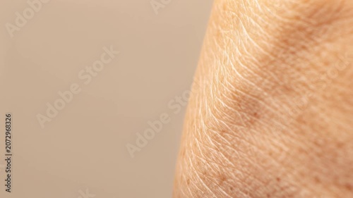 Clean macro close-up of warm healthy skin texture, skincare, dermatology, beauty, body detail, wellness