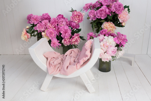 Newborn photography prop with pink peonies