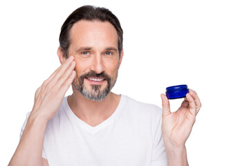 Closeup photo of mature macho guy holding new night cream applying cheek skin metrosexual want get rid of wrinkles wear white t-shirt isolated grey color background
