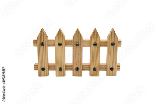 A small wooden picket fence section with five vertical slats and horizontal rails, isolated on a white background, for architectural projects