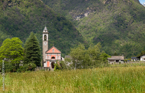 Scenic landscape featuring the Parish Church of San Maurizio in Maggia, a charming village in the Canton of Ticino, Switzerland.