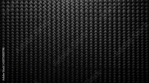 Black carbon fiber texture background closeup.