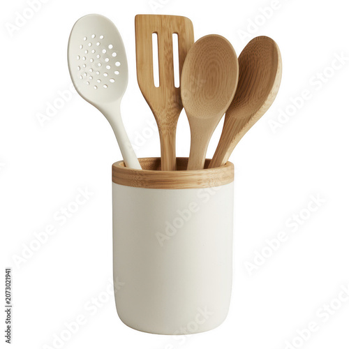 A white kitchen utensil holder containing a white slotted spoon and three wooden spoons, arranged together on a plain and clean white background