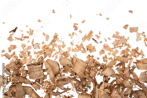 Scattered wood shavings and curled sawdust chips isolated on a Transparent background, showing natural texture, woodworking waste, and rustic material for craft or carpentry themes.