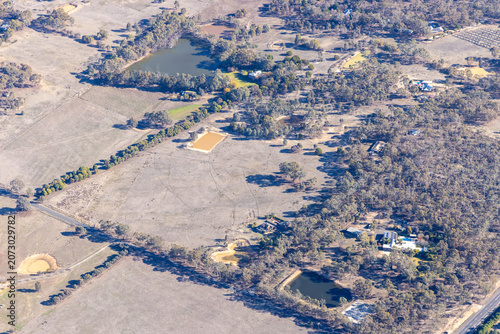 Strathfieldsaye Bendigo aerial view of farmland and rural housing and water reservoirs, Victoria Australia