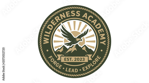 A majestic eagle soars over mountains with sun rays in a circular Wilderness Academy logo.