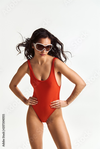 Canvas Print Radiant young woman in vibrant swimsuit enjoying a sunny summer day