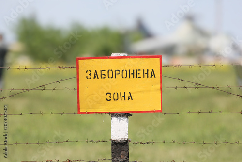 A close-up of a yellow warning sign that reads 