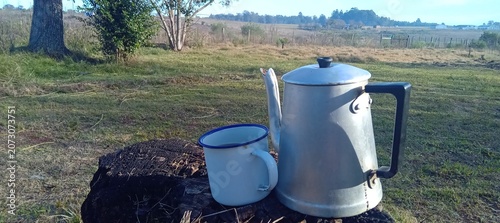 Photos coffee pot in a garden