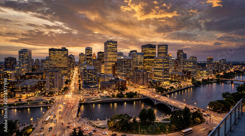 Aerial View of Illuminated Generic City Skyline at Night with Waterfront and Urban Lights