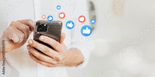 Slika na platnu Businessman checking his social media account and messages on a phone