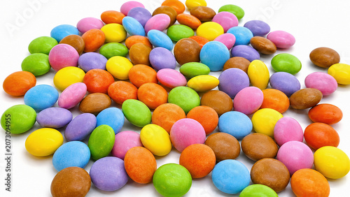 Colorful Candy Coated Chocolate Dragees Scattered on White Background