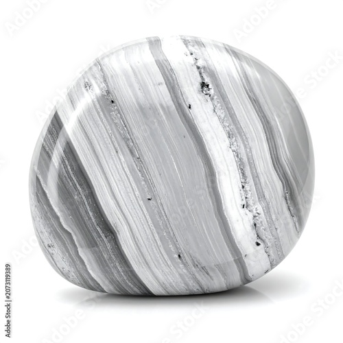 A close-up of a smooth, spherical object with intricate grey and white stripes
