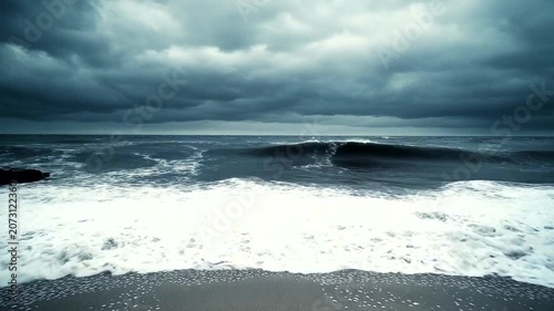 Dramatic Ocean Waves Under Dark Stormy Skies