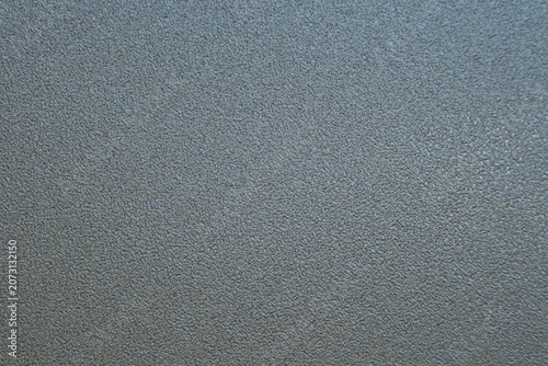 Quadro su tela A solid slate-blue background with a subtle, fine-grained texture and a very soft, barely perceptible gradient