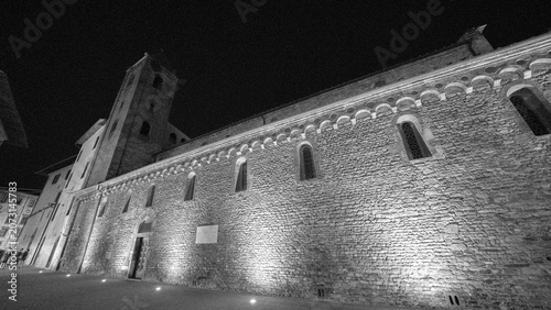 Beautifully lit Pisa church at night close to Via Santa Maria showcasing classic architecture