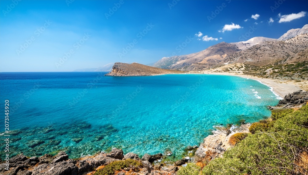Obraz premium clear blue sea and mountain coast at gianiskari beach crete