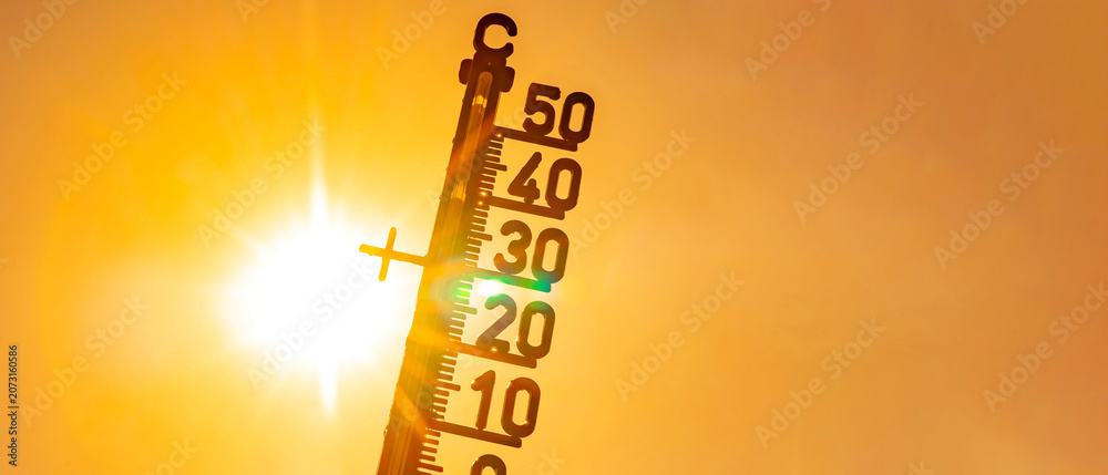 Fototapeta premium Hot weather - Heat wave / Summer heat background - Thermometer yellow orange sky and sun rays