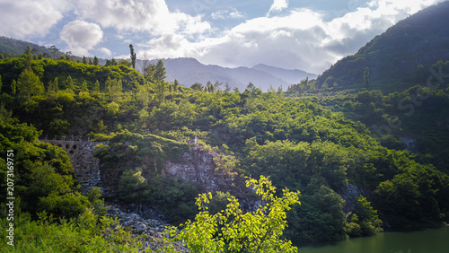 Tableau sur toile Completely reclaimed green landscape of a former quarry after successful human r