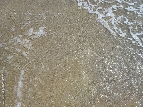 view of ocean waves rolling into the shoreline