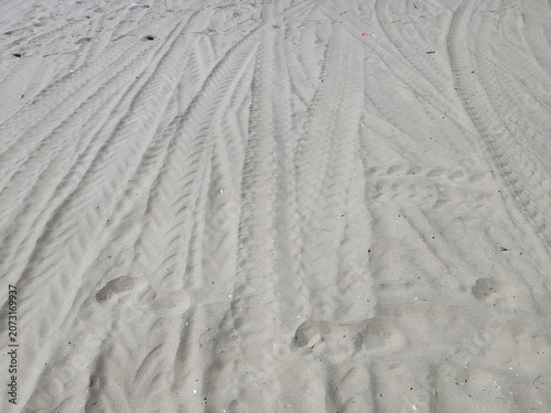 Detailed texture of sand dunes pattern on a tropical beach coast