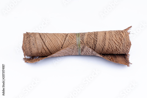 Roll of coconut fiber texture on a white background; a material for shoe soles, featuring the natural texture of coconut coir fiber—an eco-friendly material (Cocos nucifera).