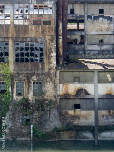 Abandoned textile mill by the Nabao river in Portugal
