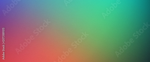 Abstract gradient background with smooth color transitions from purple and red to green and teal