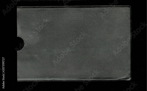 Blank textured plastic card sleeve isolated on black background