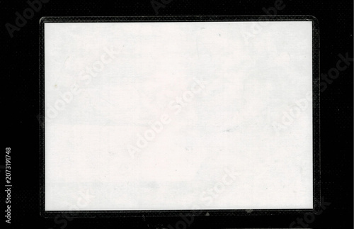 Blank white vintage photo card isolated on black background