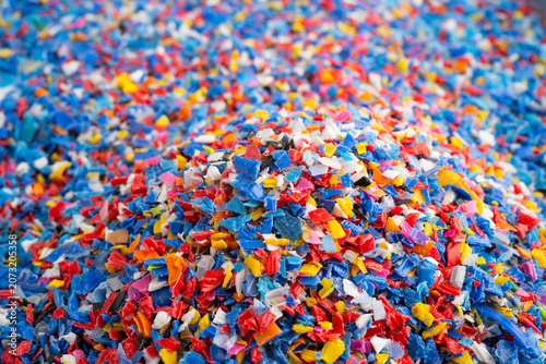 Konstfotografi Plastic colorful pieces recycling shredded for industrial use.
