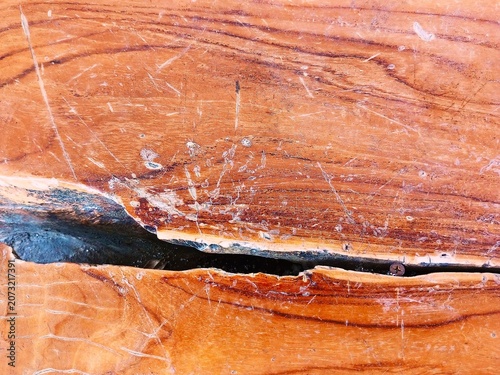 red wood texture, Polished orange wood with crack.