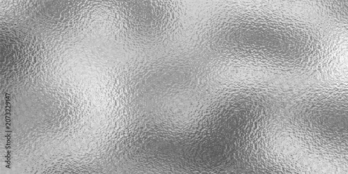 Fotografie Shiny silver foil metallic texture - glossy gray steel gleaming surface, frosted glass effect with blur glare reflection, bright polished metal material